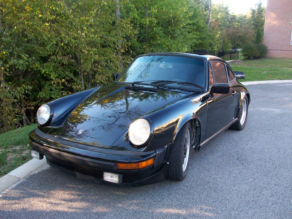 Black 2-door car at auto body repair shop in Woodbridge VA offering collision repair and trusted car body shop services