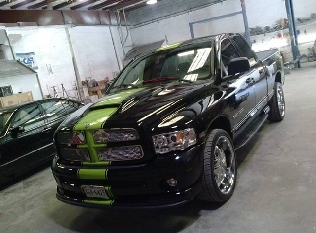 Black 4WD vehicle at auto body repair shop in Woodbridge VA offering collision and mechanical repair services